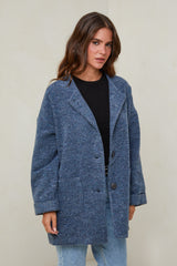 665 Manteau court tissu à motif, col rond fermeture à 4 boutons avec deux poches à l'avant